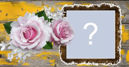 Photo frame with roses and wooden background with shades of yellow. Add a photo!